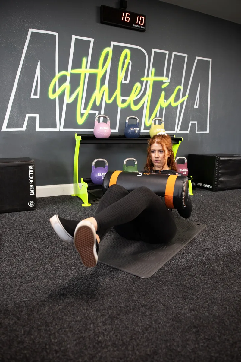 Overhead carry exercise with power bag