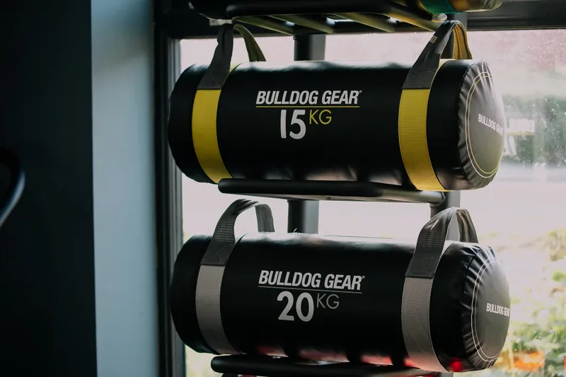 Bulldog Gear power bags lined up on the rack at Alpha Athletic