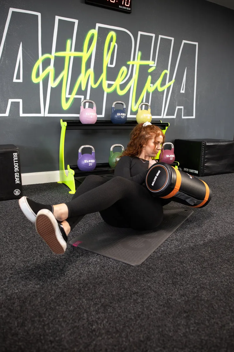 Russian twist exercise with power bag