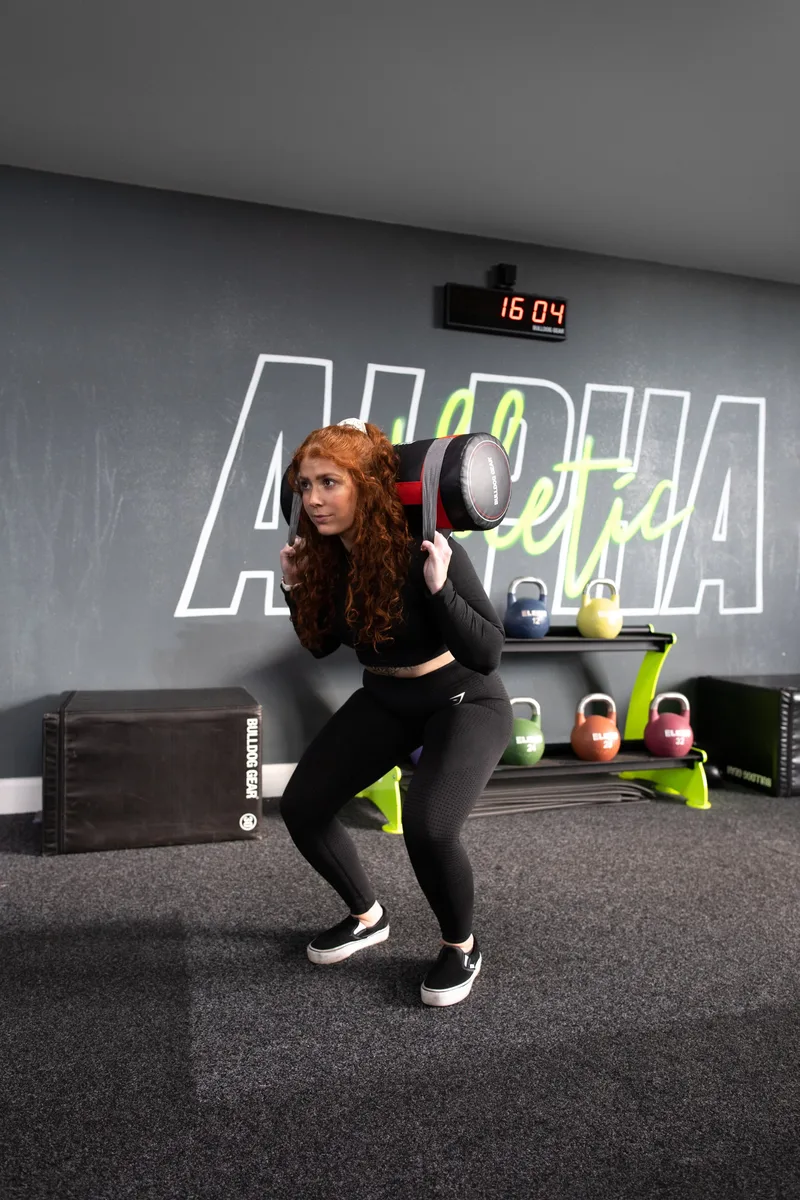 Power bag squat to press exercise
