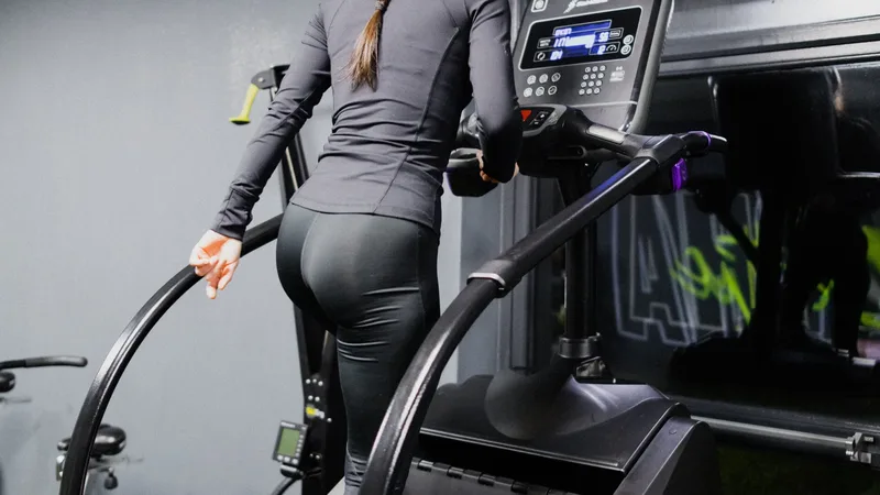 Person using a StairMaster cardio machine at Alpha Athletic gym